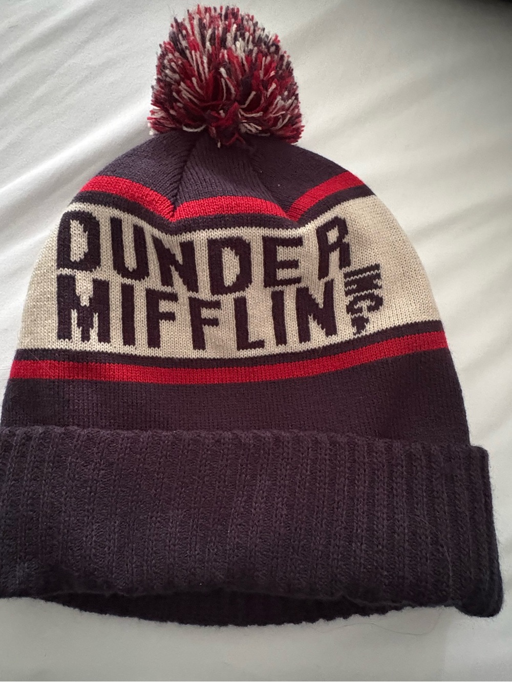 The Office Dunder Mifflin Navy Blue Knit Pom Beanie Hat - NBC Universal